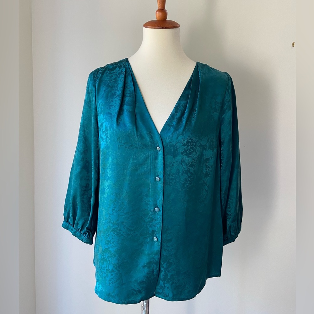 Pretty teal silk like F21 blouse with 3/4 sleeves and covered buttons.